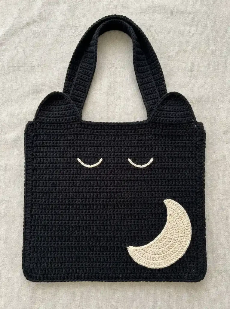 Sleepy Black Cat Crochet Tote Bag With Rounded Ears And Crescent Moon Pocket